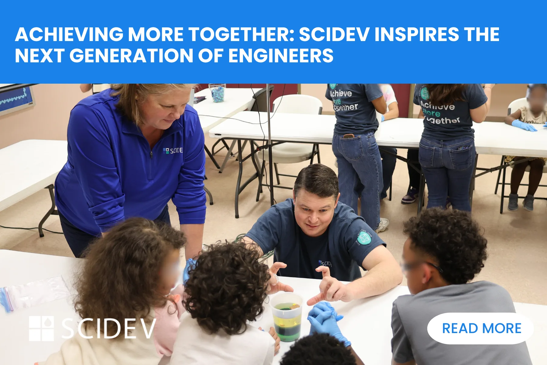 SciDev employees preforming STEM experiment with children at Salvation Army Red Shield youth Center.